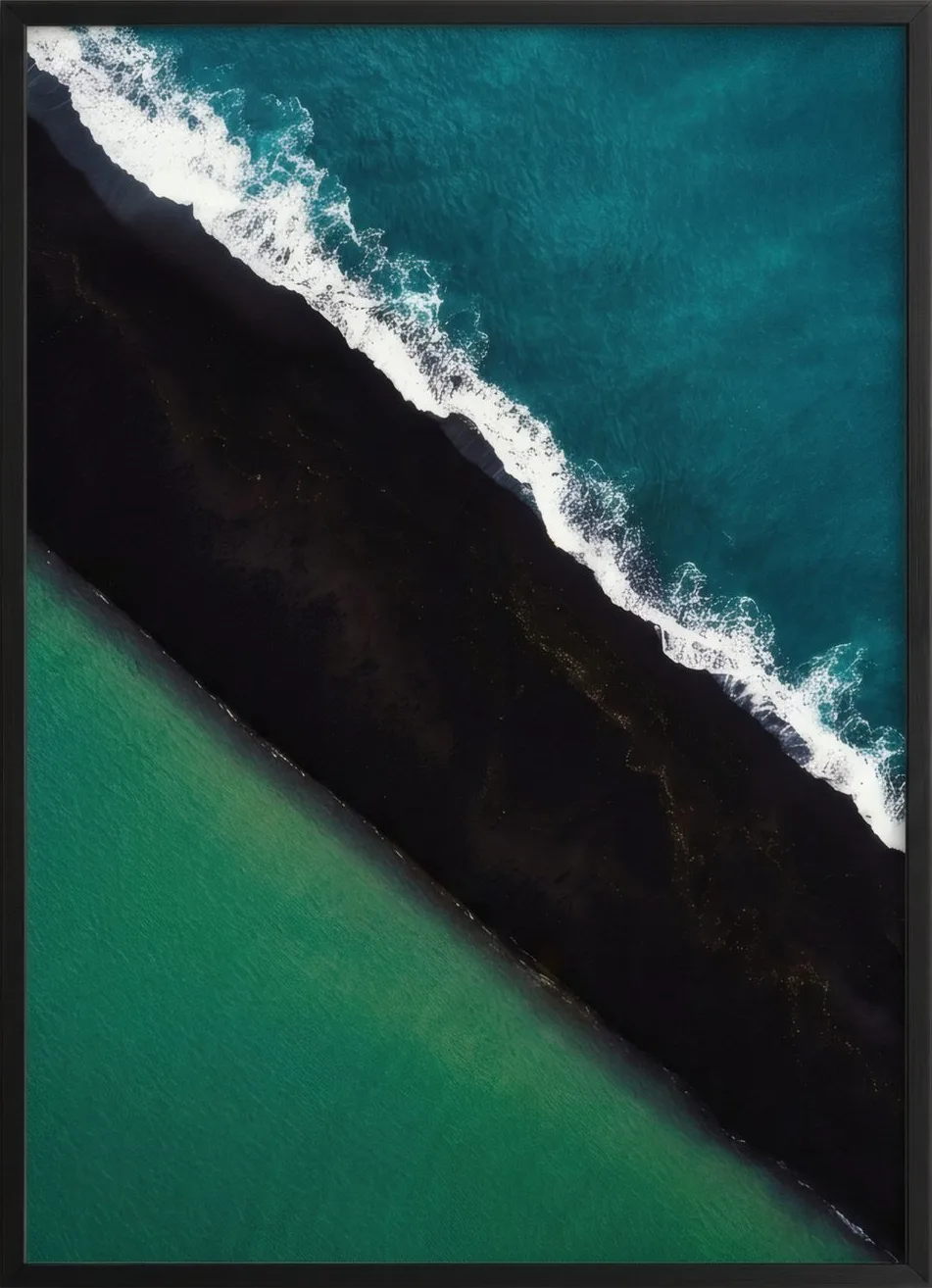 Teal ocean meeting a black volcanic beach on a long diagonal.