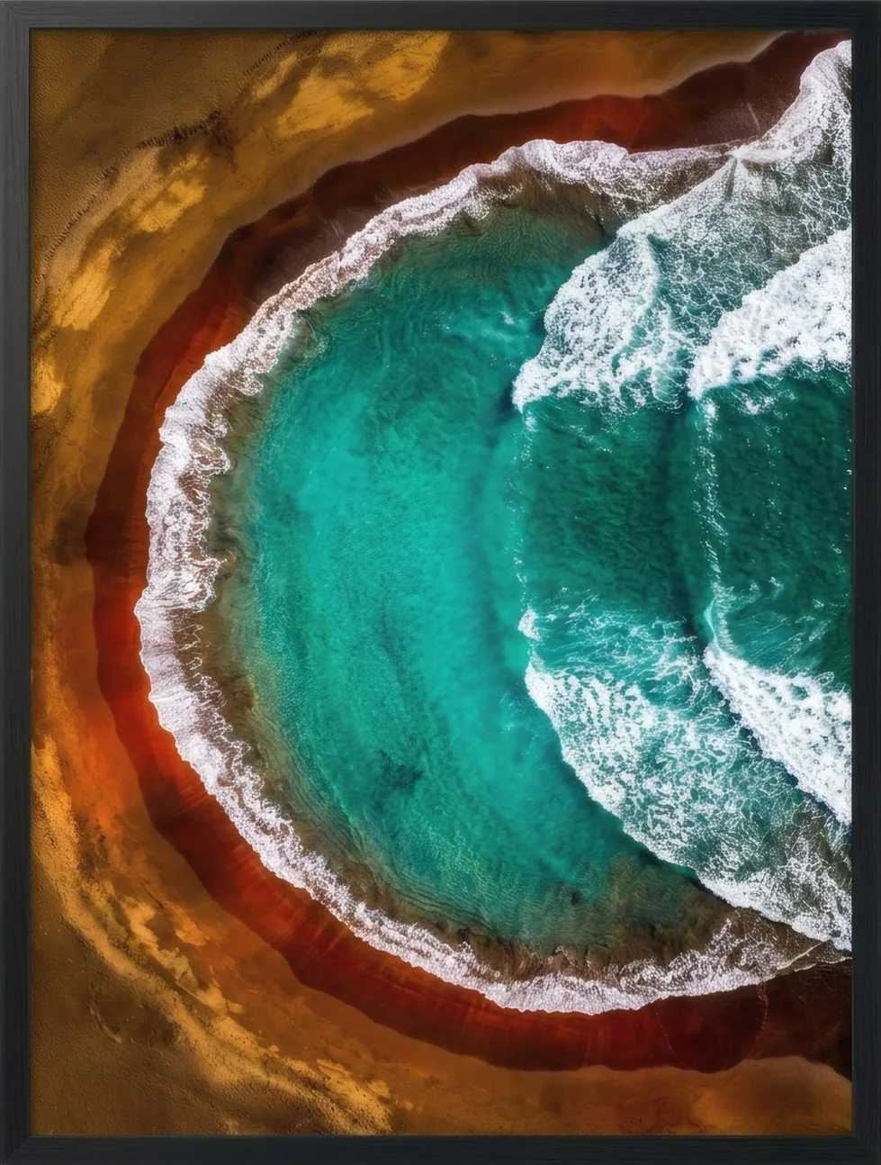 Turquoise water breaking white over a dark shore, seen from above.